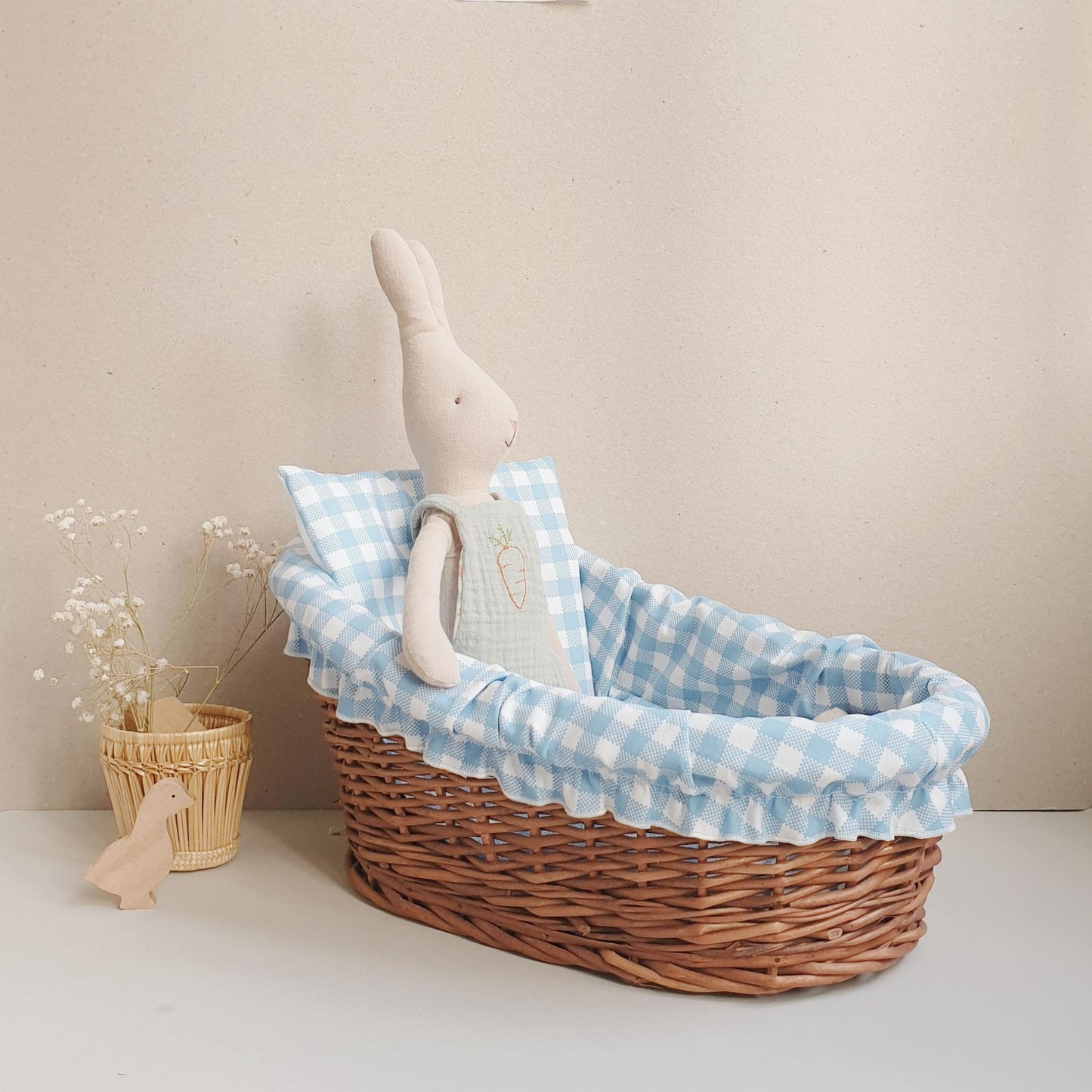 coconeh rattan doll bed with blue linen